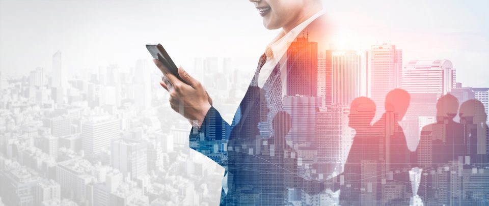 Double Exposure Image of Business Communication Network Technology Concept - Business people using smartphone or mobile phone device on modern cityscape background.