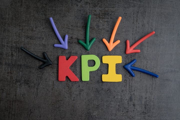 KPI, Key Point Indicator business target and goal management concept by multiple arrow pointing to colorful alphabet at the center